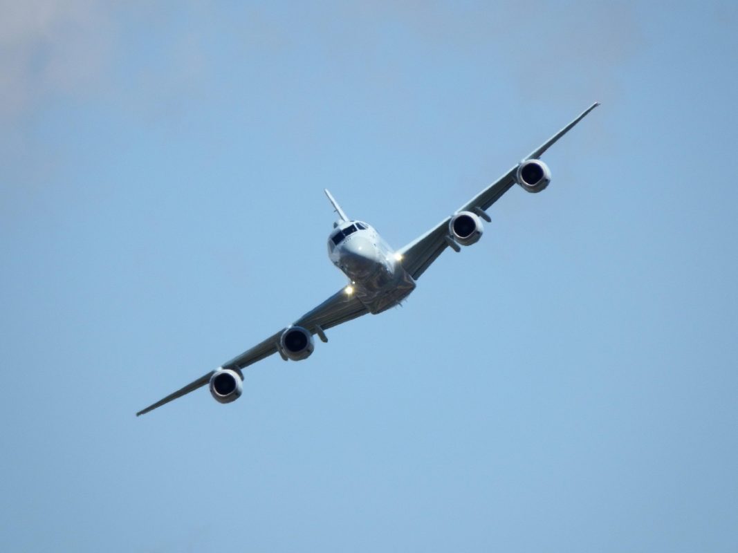 Illustrative maritime patrol aircraft flying against a clear sky.
