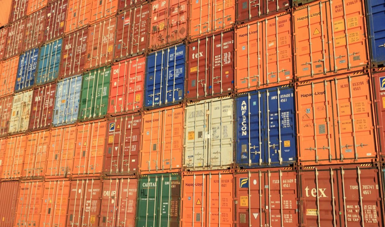 Stacks of intermodal shipping containers at a port terminal