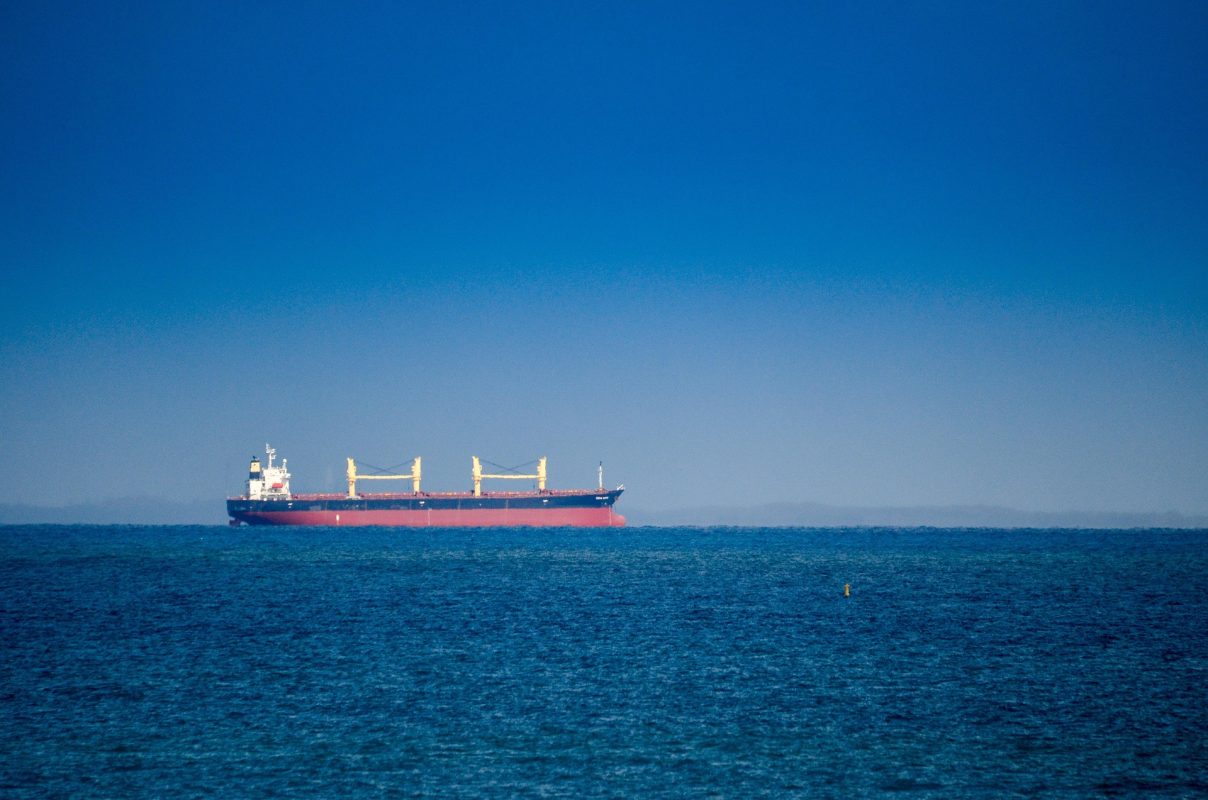 Commercial cargo vessel sailing at sea