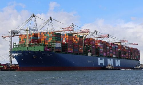 HMM container ship loading containers at Southampton port