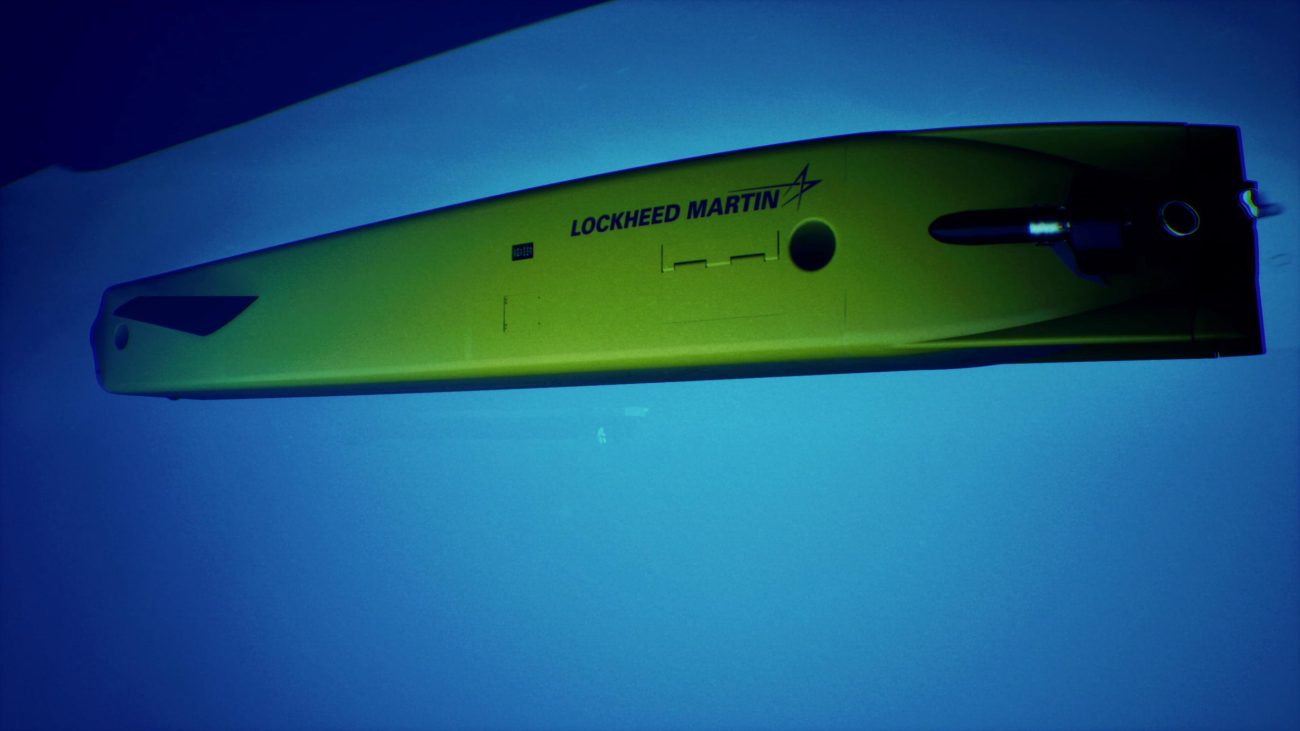 Lockheed Martin Lamprey autonomous undersea vehicle attaching to ship hull during deployment