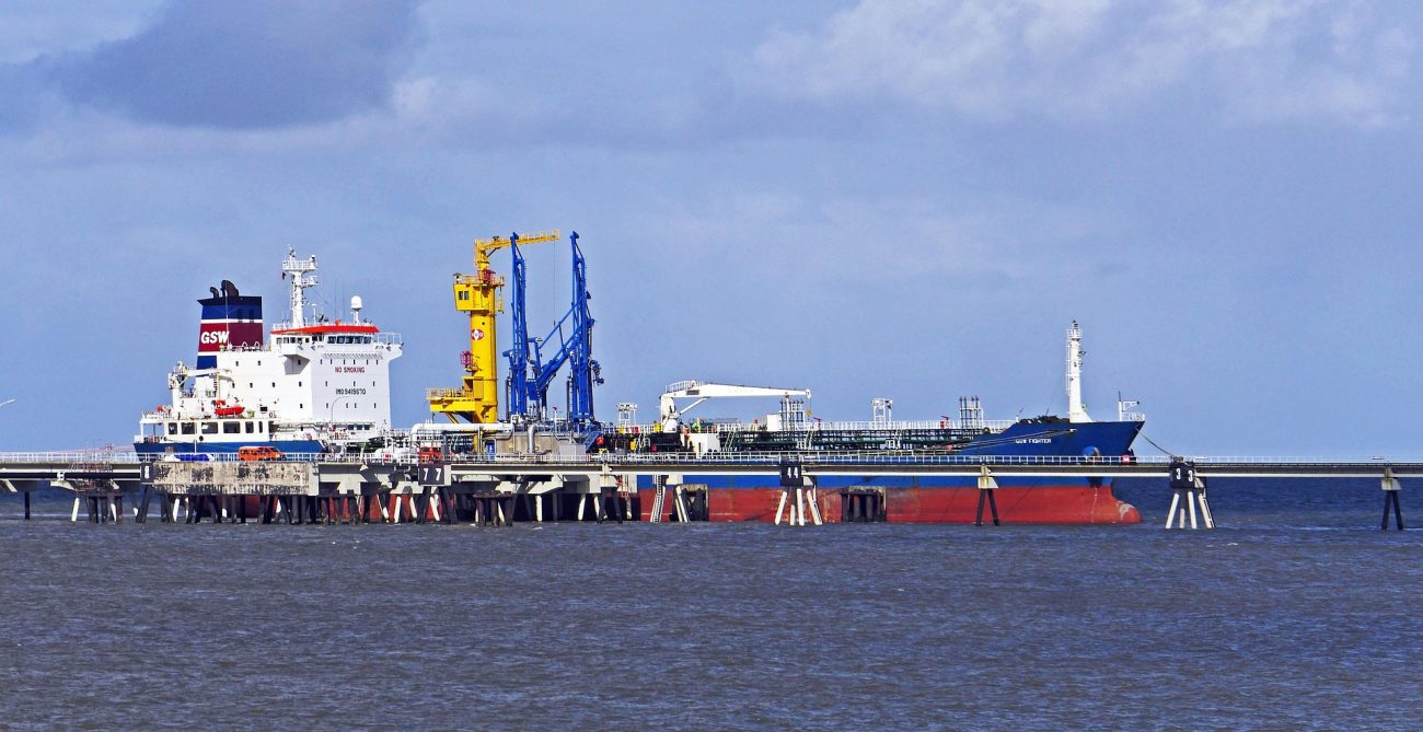 Representative oil tanker at port illustrating US sanctions on Iran linked tankers