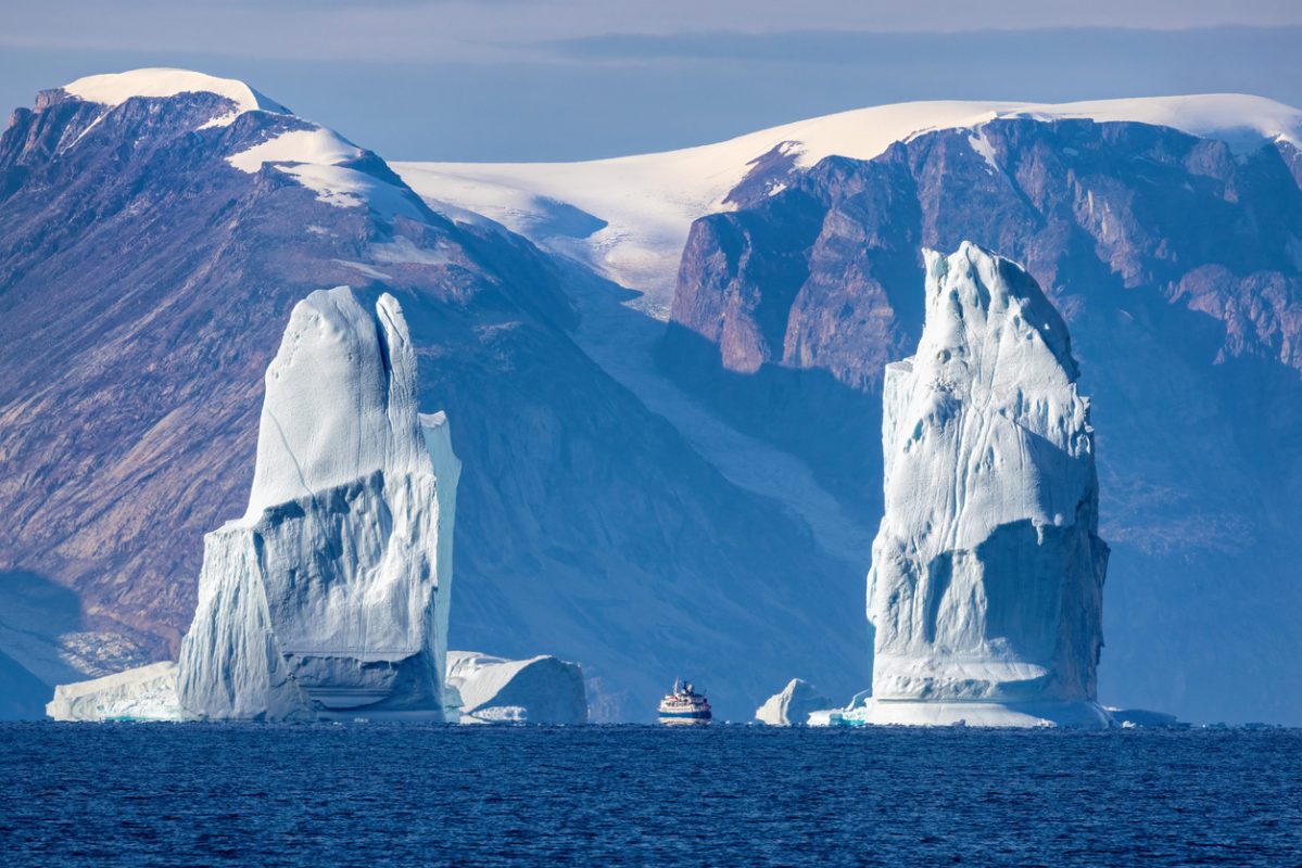 Towering icebergs in Arctic fjord near Greenland