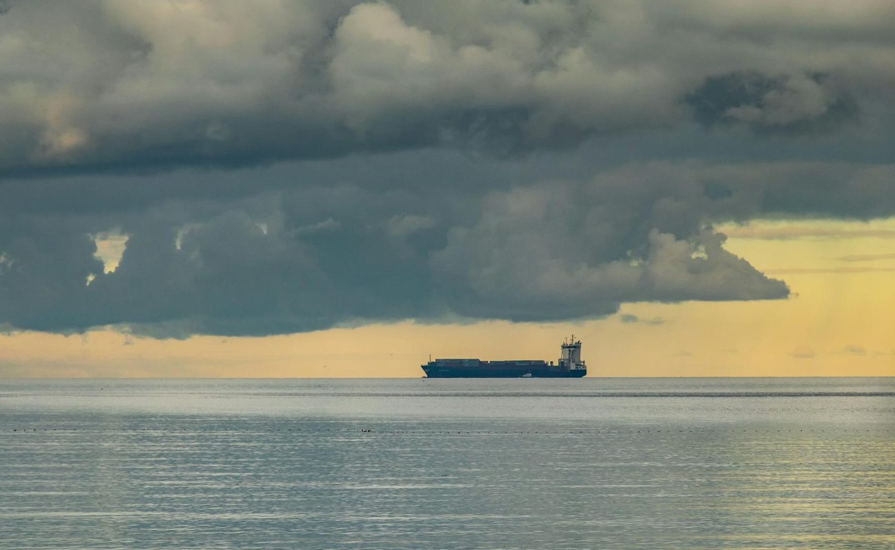 Oil tanker on the horizon in open sea