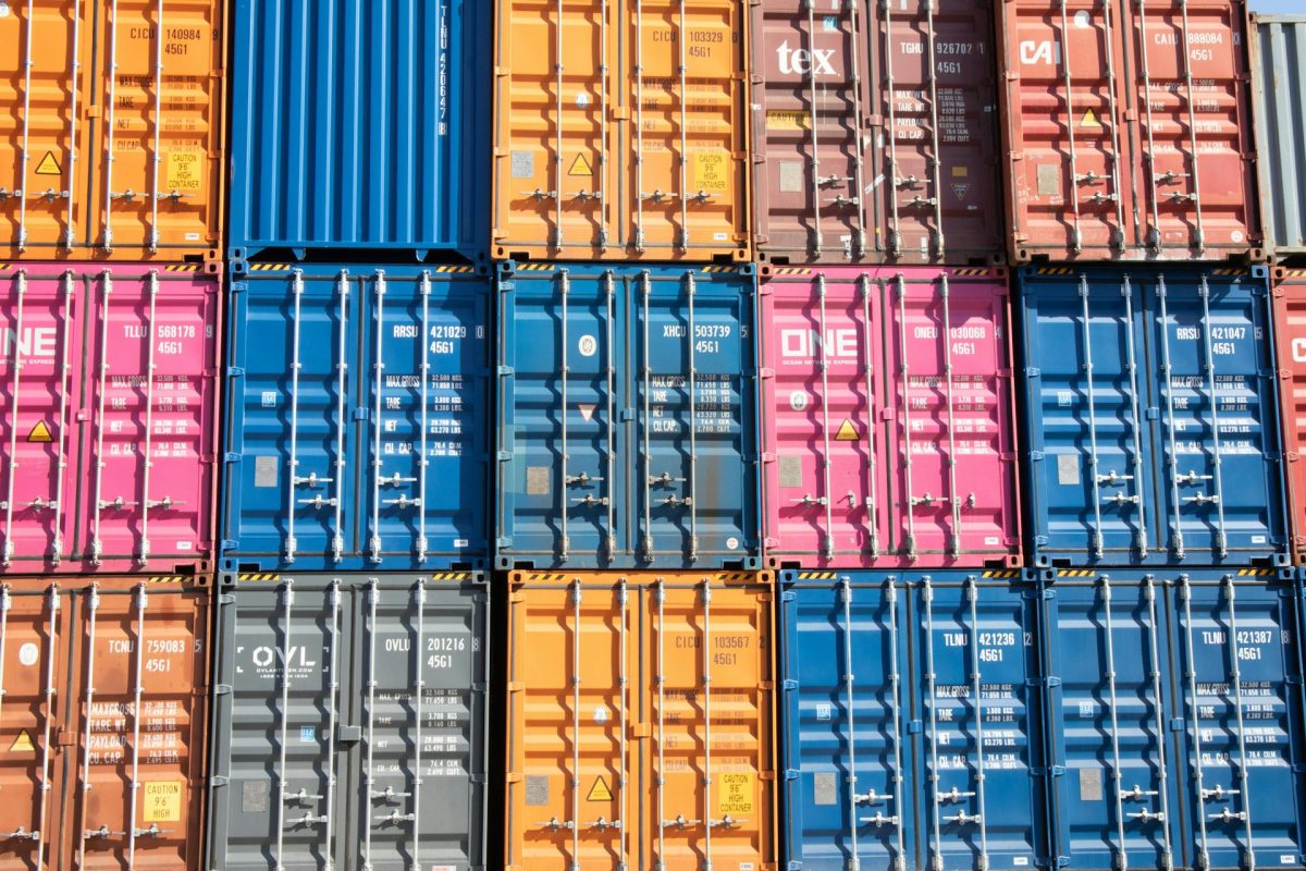 Stacks of multicolored shipping containers at a port