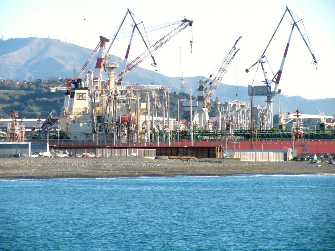Commercial cargo ship at an Italian port during dockworker strike disruption