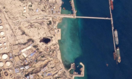 Aerial view of oil terminal and tankers loading crude cargo