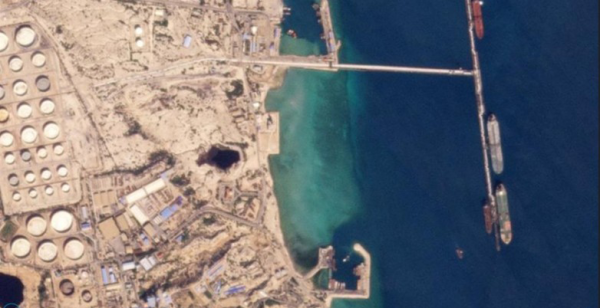 Aerial view of oil terminal and tankers loading crude cargo