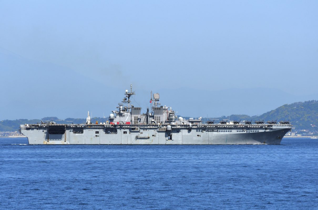 USS Tripoli amphibious assault ship at sea supporting maritime security operations in Middle East shipping routes