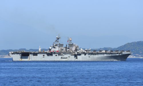 USS Tripoli amphibious assault ship at sea supporting maritime security operations in Middle East shipping routes