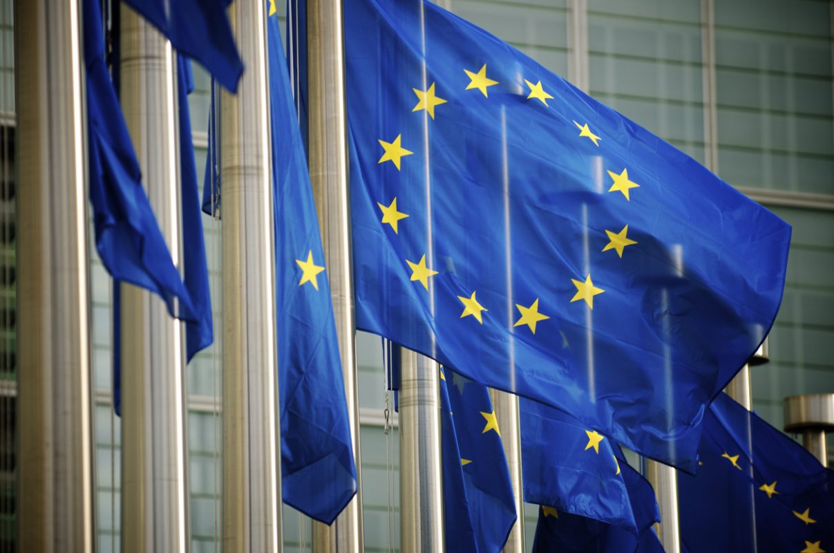 EU flags flying in front of the European Commission headquarters in Brussels