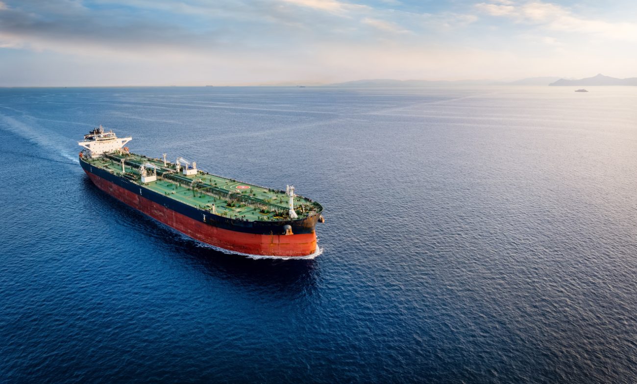 Large crude oil tanker transporting crude oil cargo across global shipping routes to Asian markets.