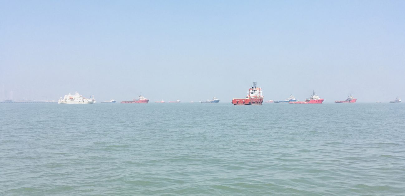 Oil tankers and merchant ships sailing in the Arabian Sea near Mumbai along major energy shipping routes.