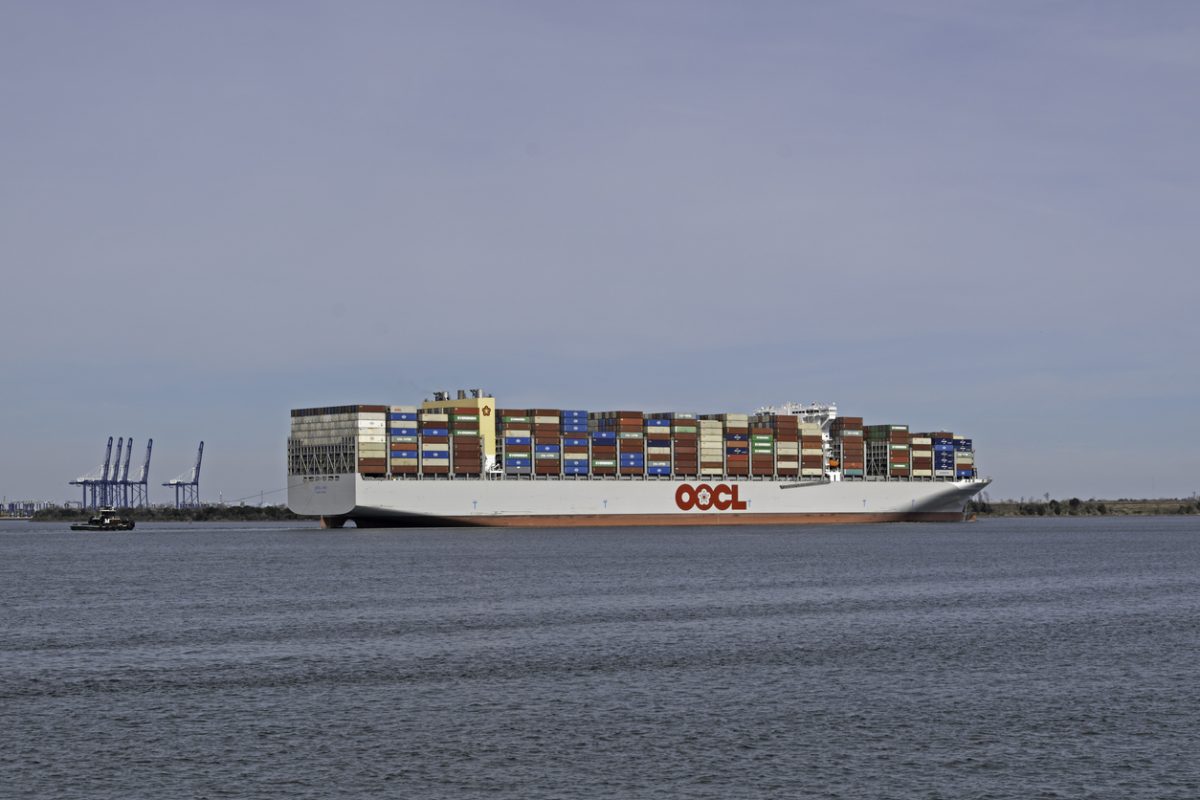 OOCL Iris container ship carrying stacked cargo containers at sea