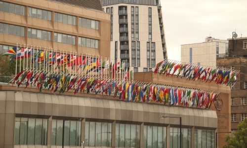 International Maritime Organization headquarters in London with national flags, IMO maritime safety body