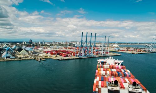 Container ship approaching terminal at Port of Long Beach showing U.S. port infrastructure and cargo operations