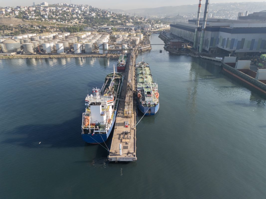 Crude oil tanker loading cargo at terminal illustrating increased global oil supply and tanker demand