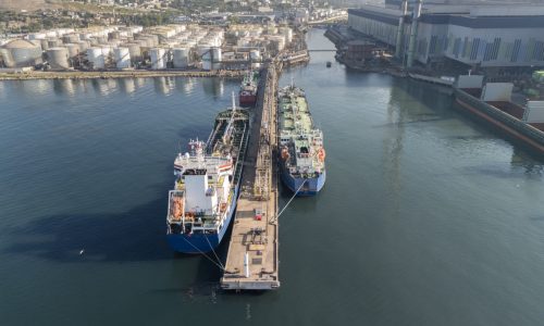 Crude oil tanker loading cargo at terminal illustrating increased global oil supply and tanker demand