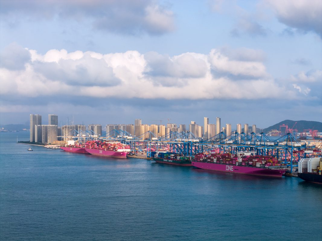 Container stacks at Qingdao Port China highlighting export volumes and US China maritime trade exposure.