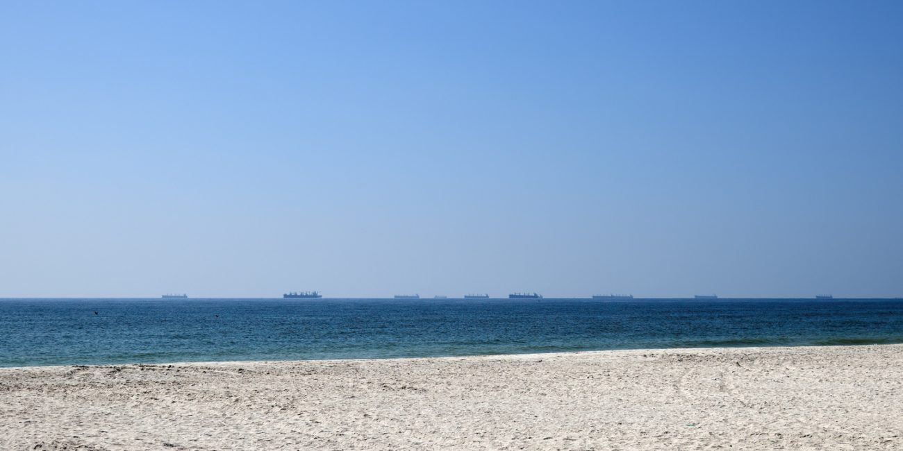 Cargo ships waiting near Strait of Hormuz shipping route Oman