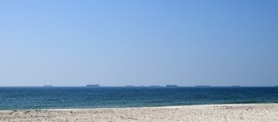Cargo ships waiting near Strait of Hormuz shipping route Oman