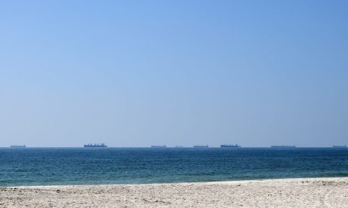 Cargo ships waiting near Strait of Hormuz shipping route Oman