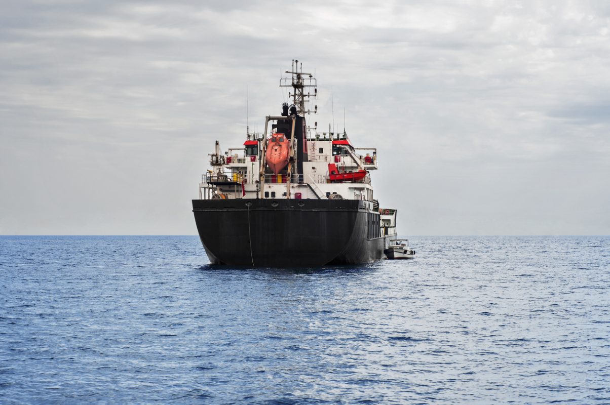Crude oil tanker transporting oil across ocean as tanker freight rates surge