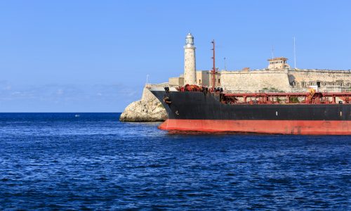 Ship near Havana harbor entrance by Castillo del Morro illustrating tanker traffic heading to Cuba