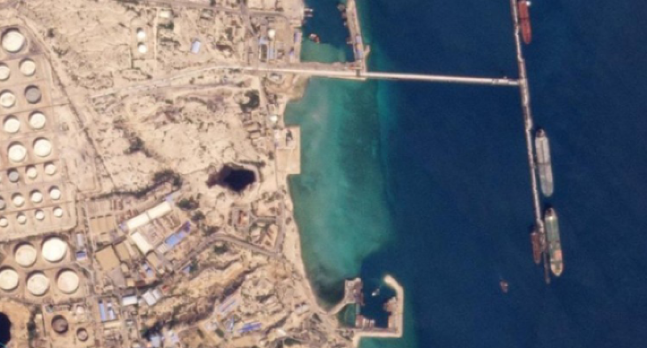 Aerial view of oil terminal and tankers loading crude cargo