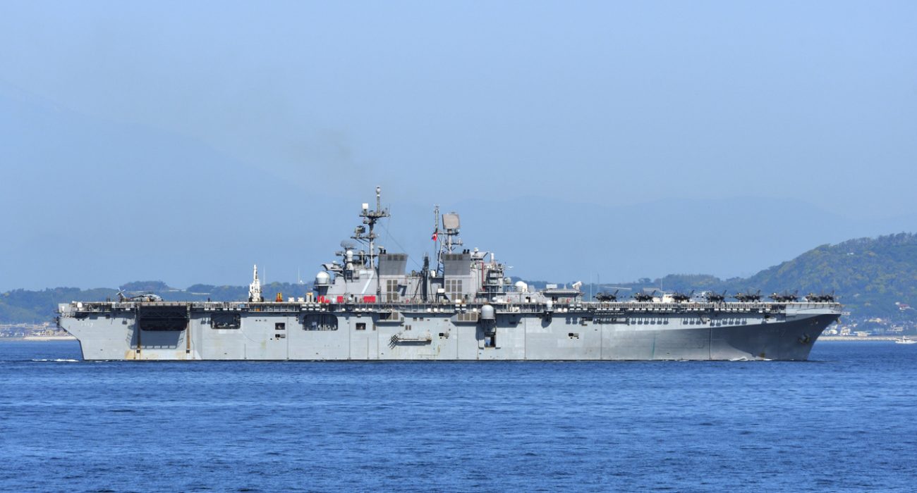 USS Tripoli amphibious assault ship at sea supporting maritime security operations in Middle East shipping routes