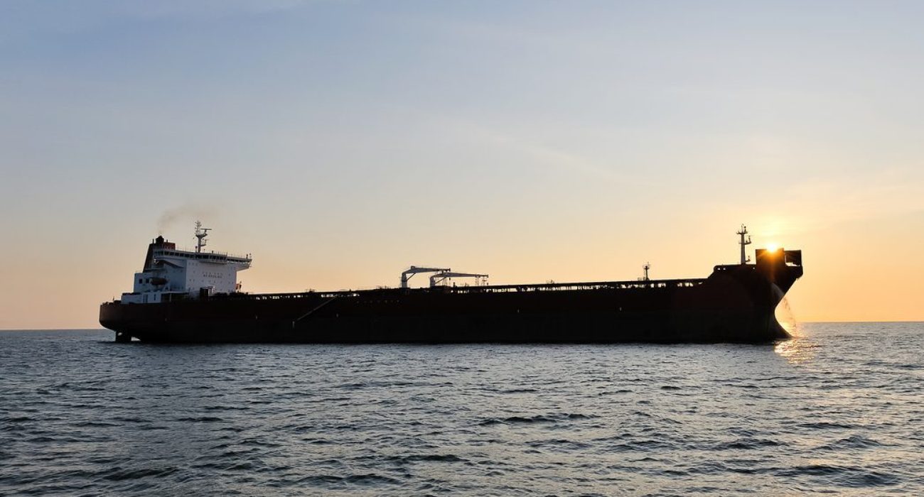Crude oil tanker transporting cargo at sea amid global oil trade and sanctions on Russian crude