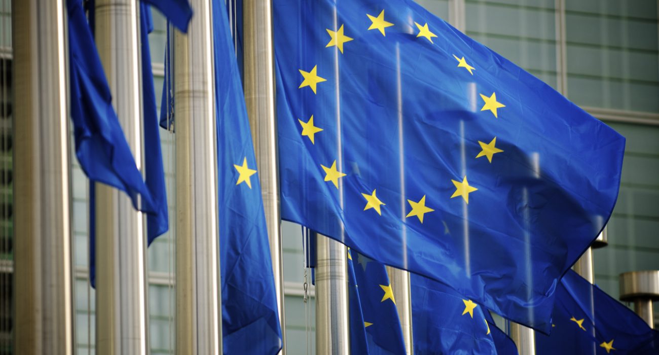 EU flags flying in front of the European Commission headquarters in Brussels