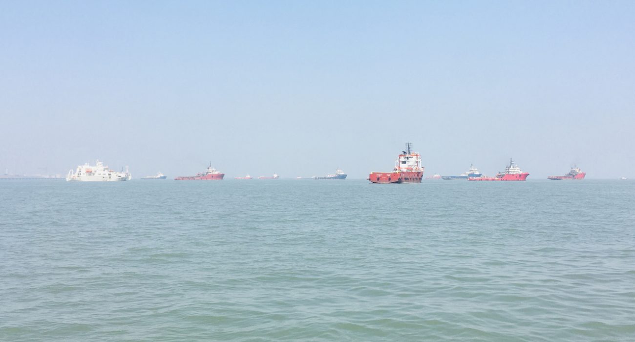 Oil tankers and merchant ships sailing in the Arabian Sea near Mumbai along major energy shipping routes.