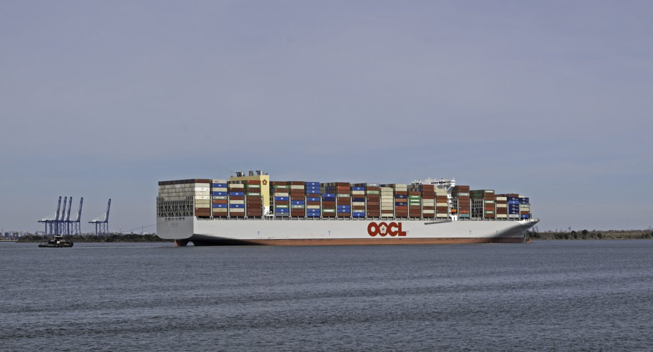 OOCL Iris container ship carrying stacked cargo containers at sea