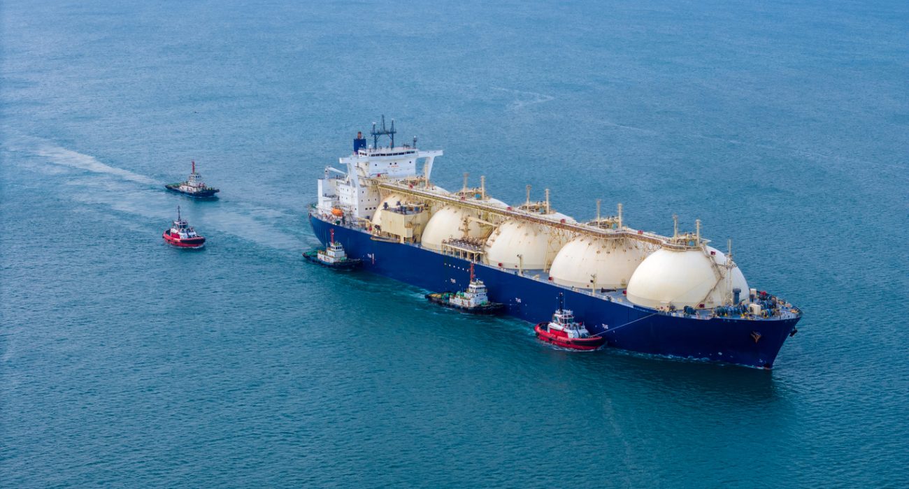 LNG tanker at marine gas terminal with storage tanks used for alternative marine fuel supply