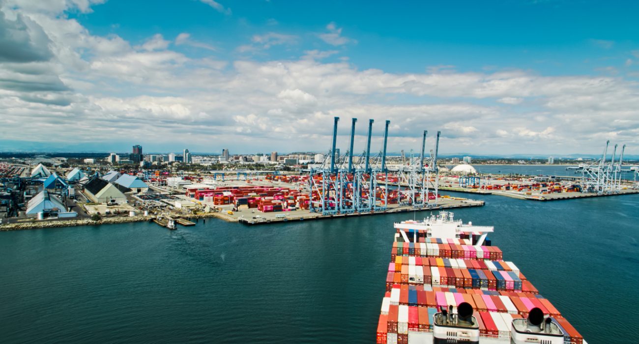 Container ship approaching terminal at Port of Long Beach showing U.S. port infrastructure and cargo operations