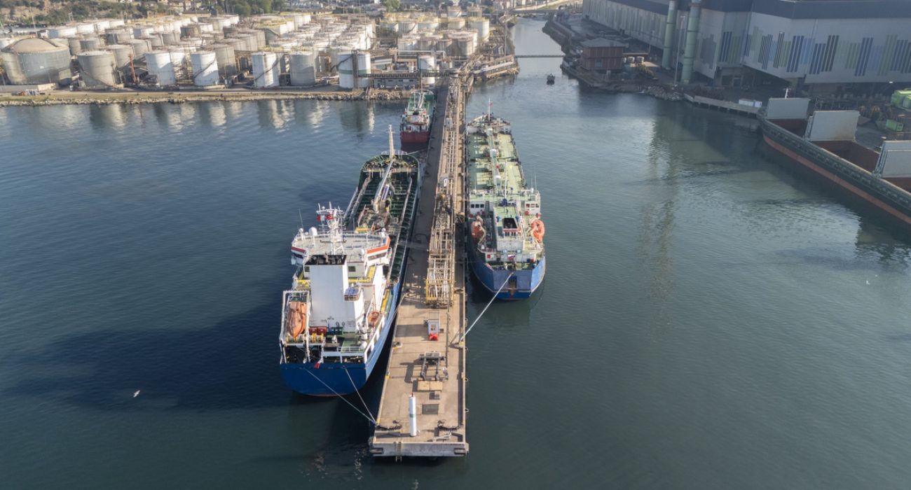 Crude oil tanker loading cargo at terminal illustrating increased global oil supply and tanker demand