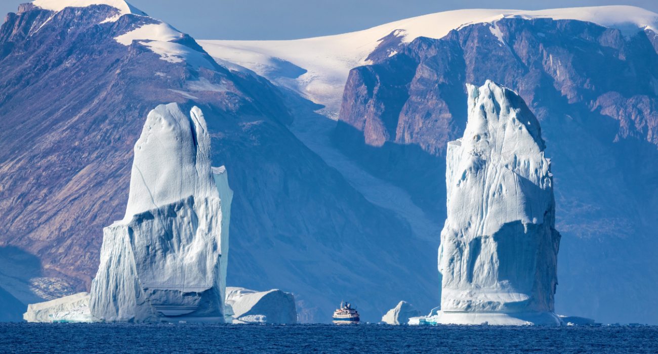 Towering icebergs in Arctic fjord near Greenland