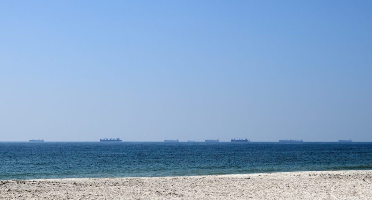 Cargo ships waiting near Strait of Hormuz shipping route Oman