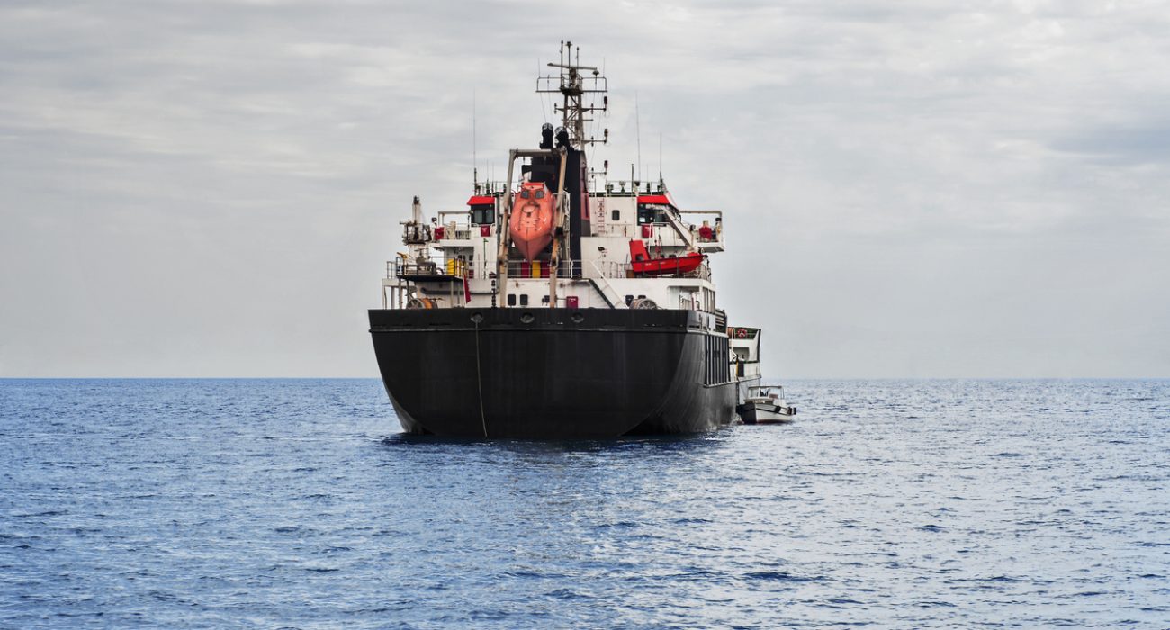 Crude oil tanker transporting oil across ocean as tanker freight rates surge