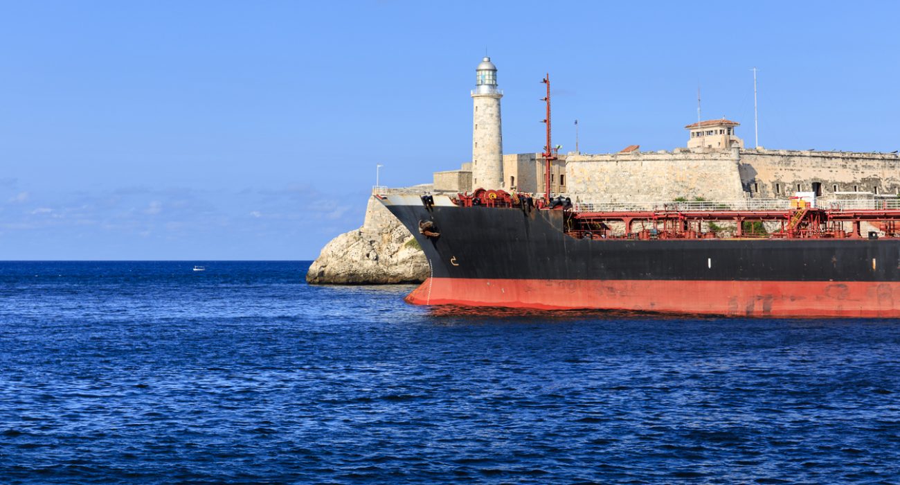 Ship near Havana harbor entrance by Castillo del Morro illustrating tanker traffic heading to Cuba