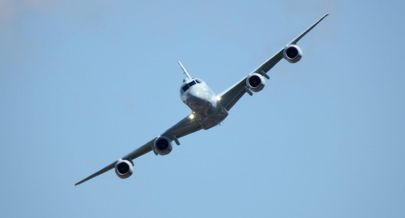 Illustrative maritime patrol aircraft flying against a clear sky.