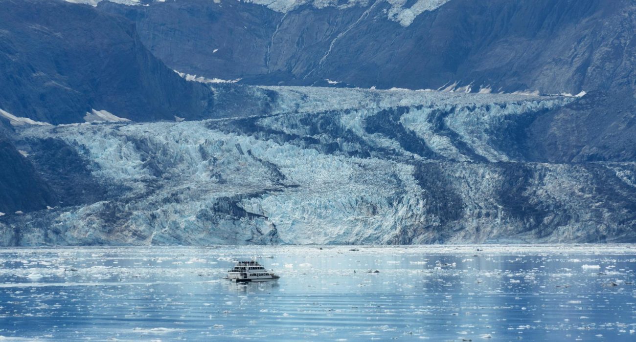 Small ship cruising icy Alaska seas during expedition season