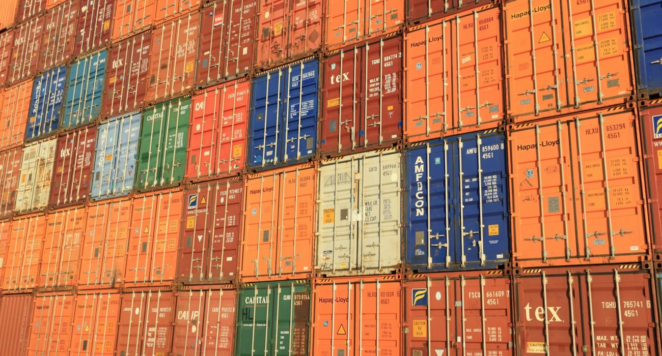 Stacks of intermodal shipping containers at a port terminal