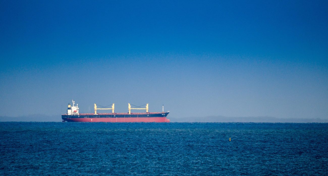 Commercial cargo vessel sailing at sea